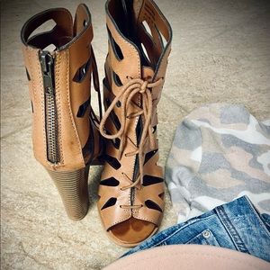 Tan, cut-out leather, lace-up booties.